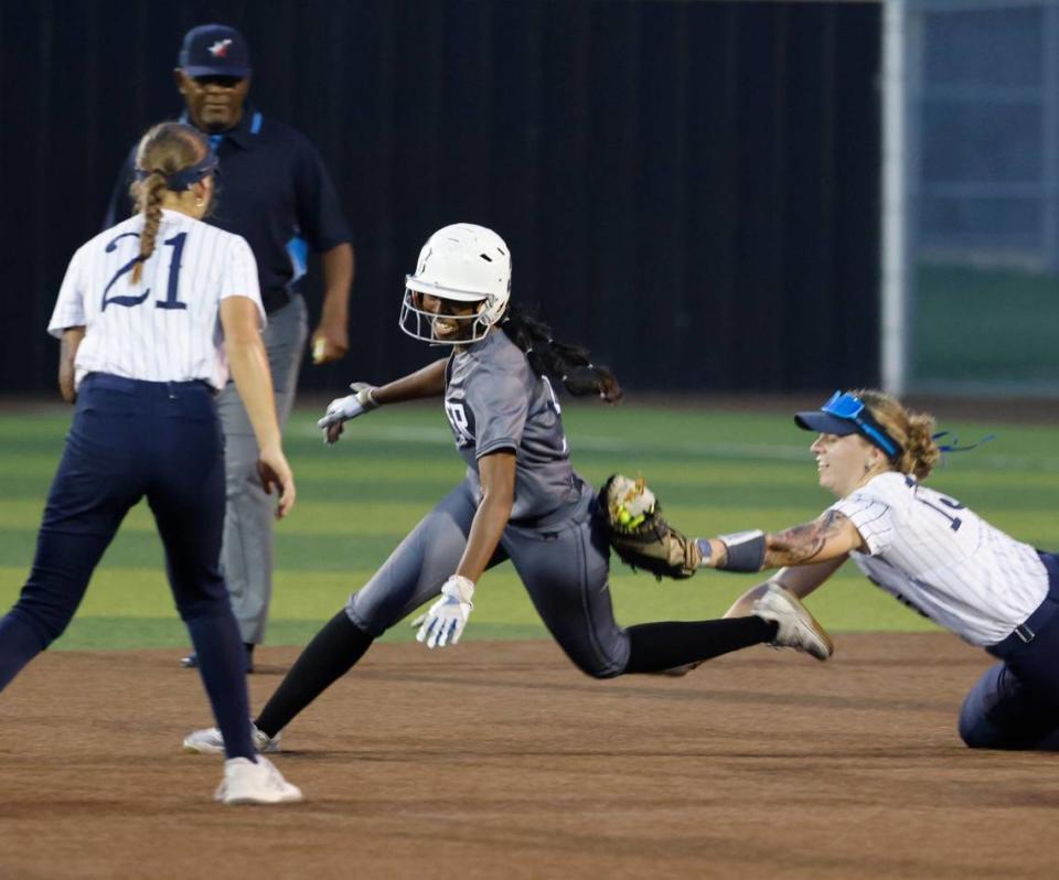 Keller first baseman Carley Genzer (15) runs down Guyer right fielder Lauryn Jones (3) during the Conference 6A Region 1 Regional Finals at Coppell Softball Field in Coppell, Texas, Saturday May 25, 2024.