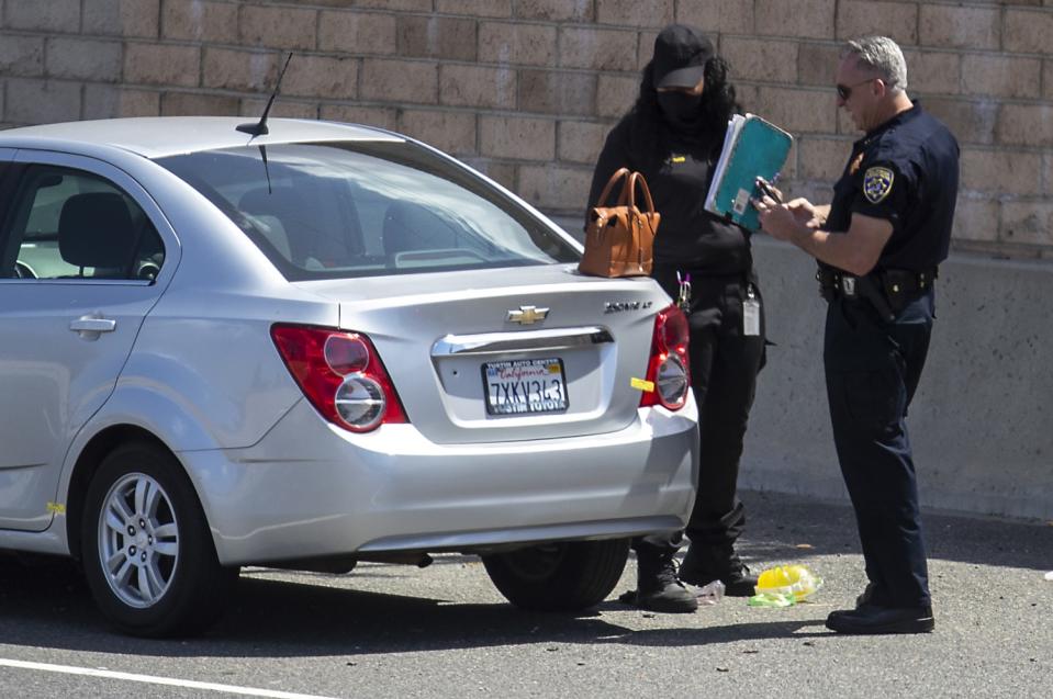 A bullet hole can be seen in the trunk of the car Aiden Leos was a riding in.