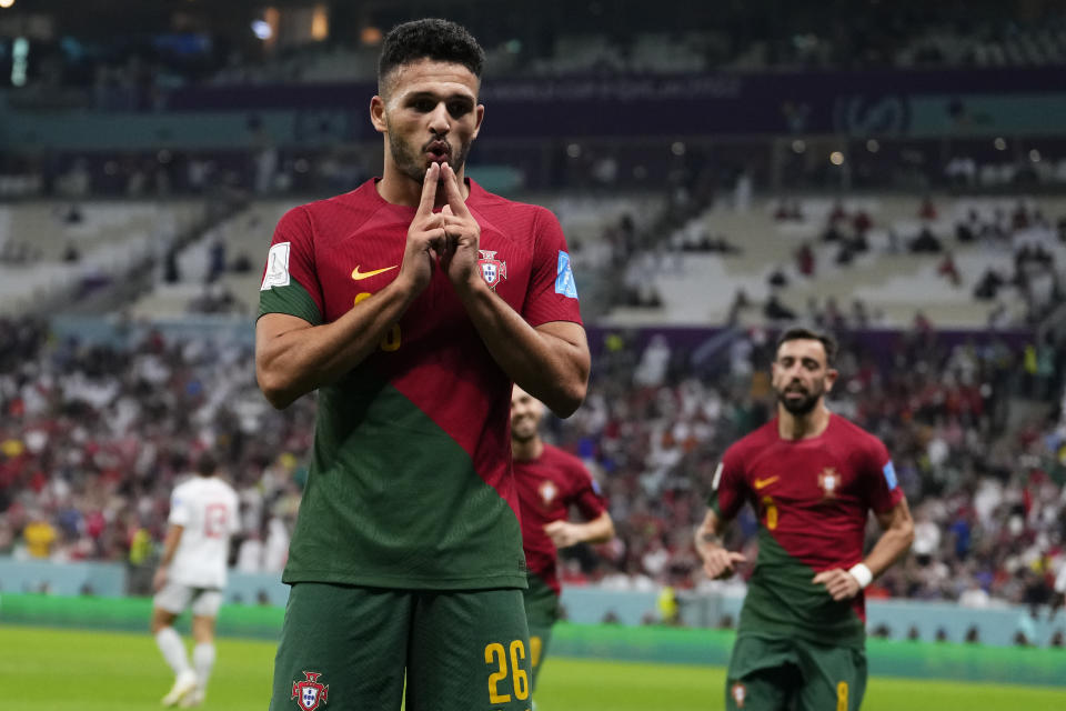 Portugal's Goncalo Ramos celebrates after scoring his his side's third goal during the World Cup round of 16 soccer match between Portugal and Switzerland, at the Lusail Stadium in Lusail, Qatar, Tuesday, Dec. 6, 2022. (AP Photo/Manu Fernandez)