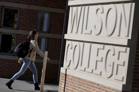 A student walks toward Princeton University's Wilson College in Princeton, New Jersey, November 20, 2015. REUTERS/Dominick Reuter