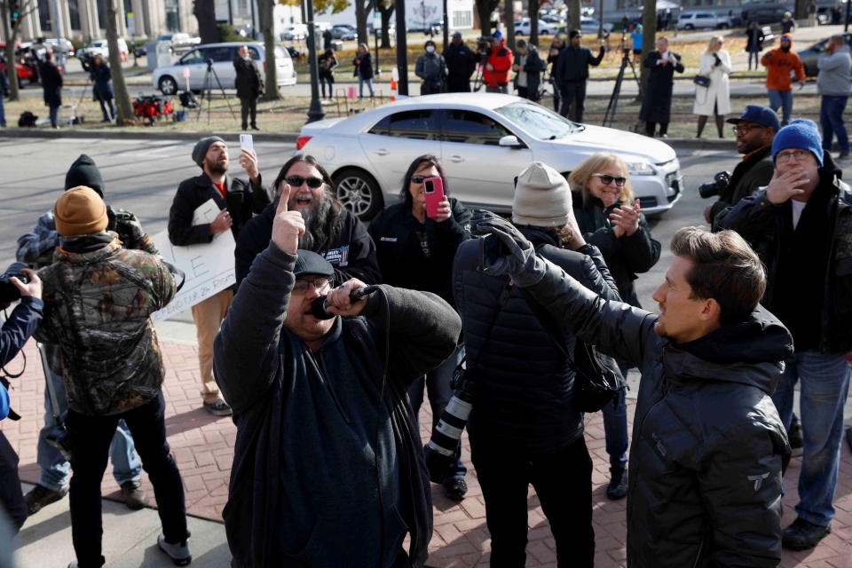 People standing outside the courthouse react to the verdict in the trial of Kyle Rittenhouse in Kenosha, Wisconsin.