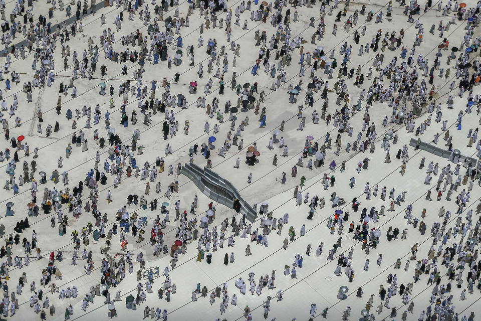 Muslim pilgrims leave Grand Mosque, after offering Friday prayers ahead of the annual Hajj pilgrimage, in the Muslim holy city of Mecca, Saudi Arabia, early Friday, Aug. 17, 2018. The annual Islamic pilgrimage draws millions of visitors each year, making it the largest yearly gathering of people in the world. (AP Photo/Dar Yasin)