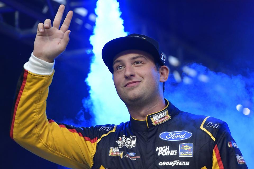 BRISTOL, TENNESSEE - SEPTEMBER 18: Chase Briscoe, driver of the #14 Rush Truck Centers/Cummins Ford, waves to fans during pre-race ceremonies prior to the NASCAR Cup Series Bass Pro Shops Night Race at Bristol Motor Speedway on September 18, 2021 in Bristol, Tennessee. (Photo by Logan Riely/Getty Images) | Getty Images