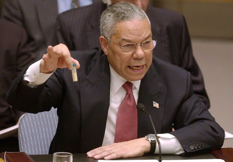 ** FOR USE AS DESIRED, PHOTOS OF THE DECADE ** FILE - Secretary of State Colin Powell holds up a vial he said could contain anthrax as he presents evidence of Iraq's alleged weapons programs to the United Nations Security Council in this Feb. 5, 2003 file photo. (AP Photo/Elise Amendola, File)