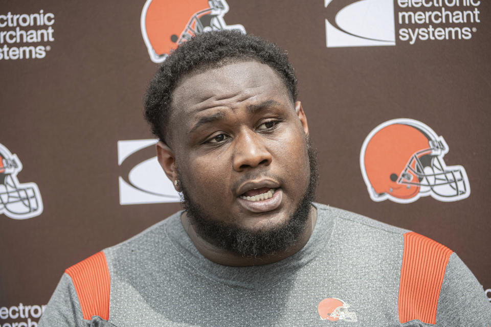 FILE - Cleveland Browns rookie Dawand Jones speaks to reporters before the Browns NFL football rookie minicamp in Berea, Ohio, Friday, May 12, 2023. A fourth-round pick from Ohio State, Jones came off the bench last week and made his NFL debut after starter Jack Conklin suffered a season-ending knee injury. (AP Photo/Phil Long, File)