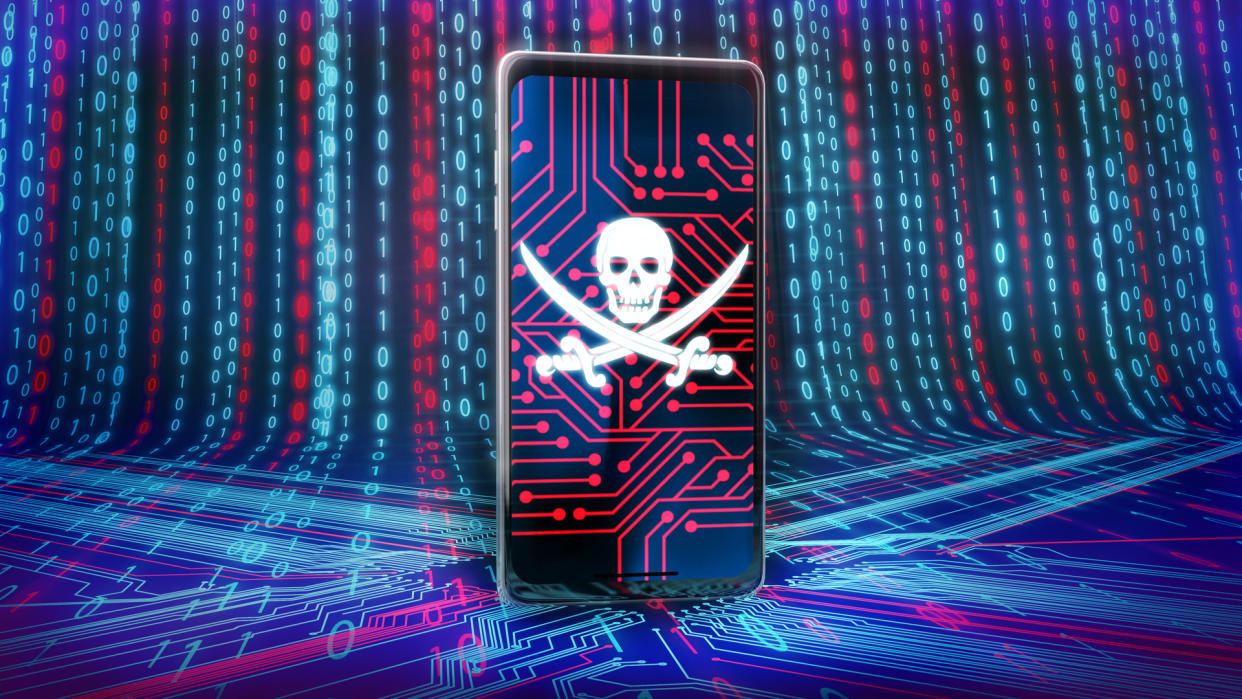  A picture of a skull and bones on a smartphone depicting malware. 