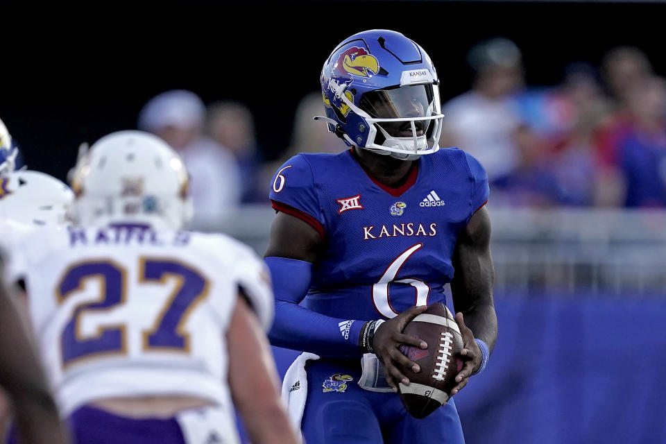 Kansas quarterback Jalon Daniels (6) looks to throw the ball during the first half of an NCAA college football game against Tennessee Tech Friday, Sept. 2, 2022, in Lawrence, Kan. (AP Photo/Charlie Riedel)