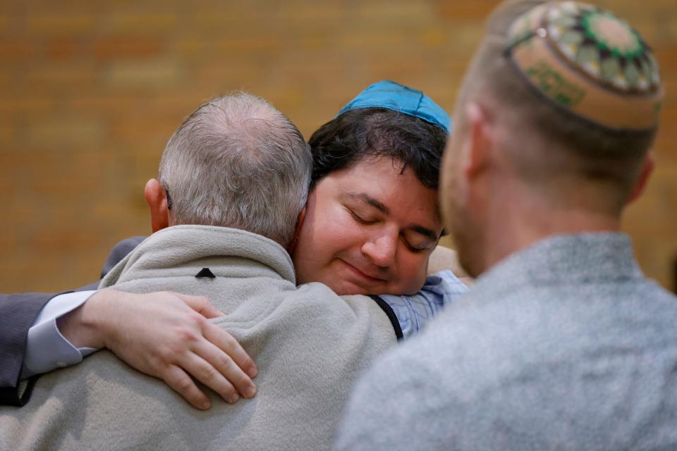 Elliott Wulff, student cantor of Temple B'nai Israel, hugs another person after the Prayer Vigil for Israel hosted by the Oklahoma City Jewish community on Thursday at Temple B'nai Israel in Oklahoma City.