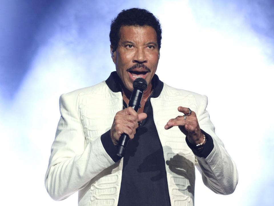 Lionel Richie performing on stage.
