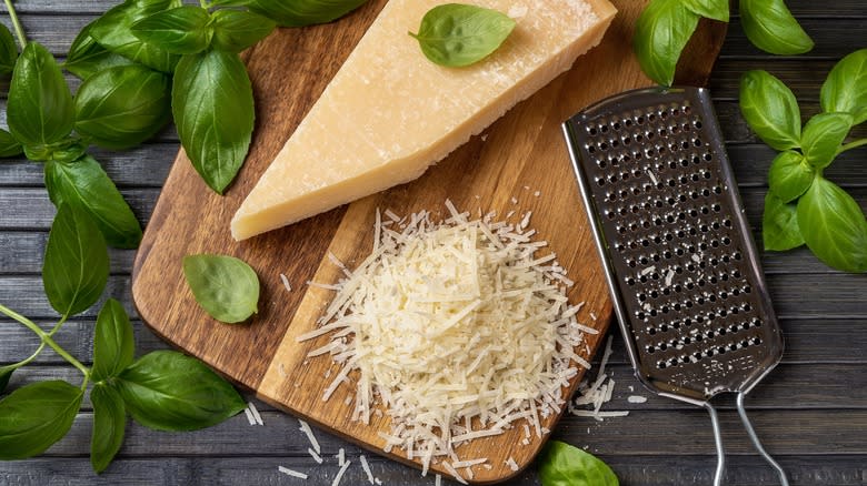 Parmesan cheese on wooden board