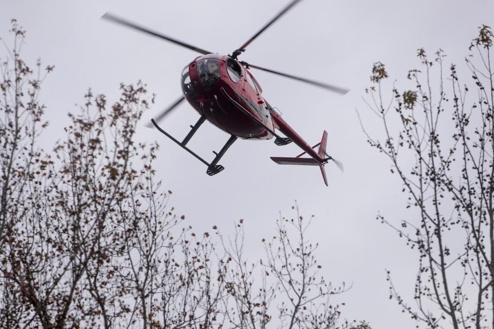 The USDA Wildlife Services helicopter used for feral pig control at Land Between the Lakes is painted red and black with an almost wave design on the side.