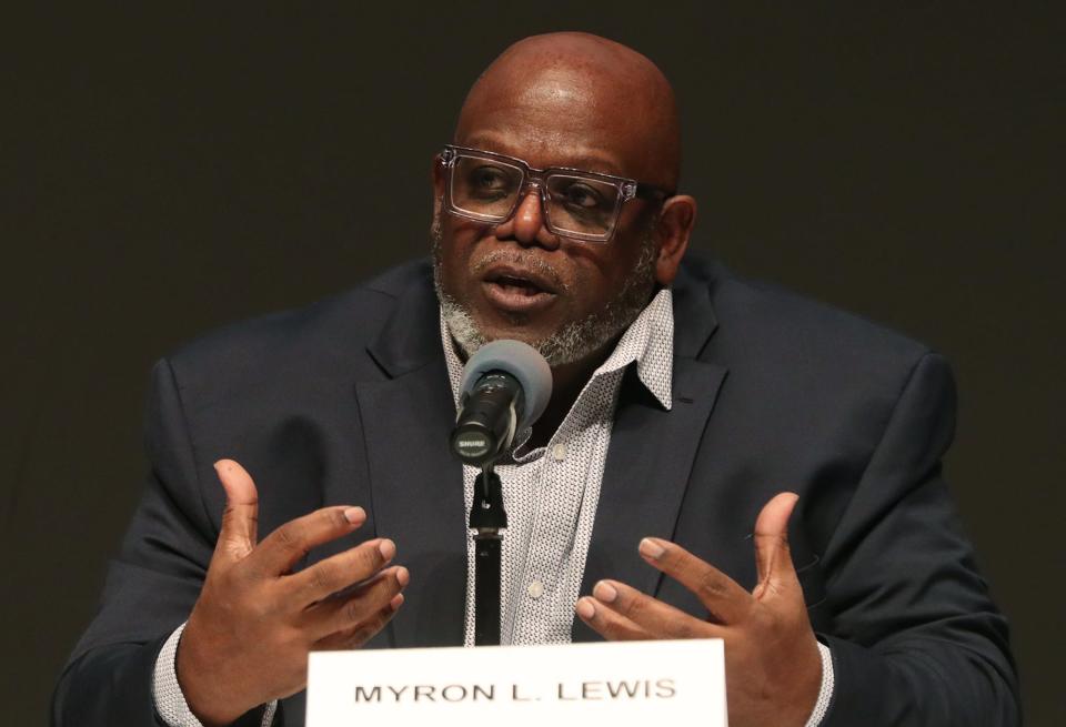 School Board candidate Myron L. Lewis answers a question during the Akron City School Board Candidate Forum at the Akron-Summit County Library in Akron.