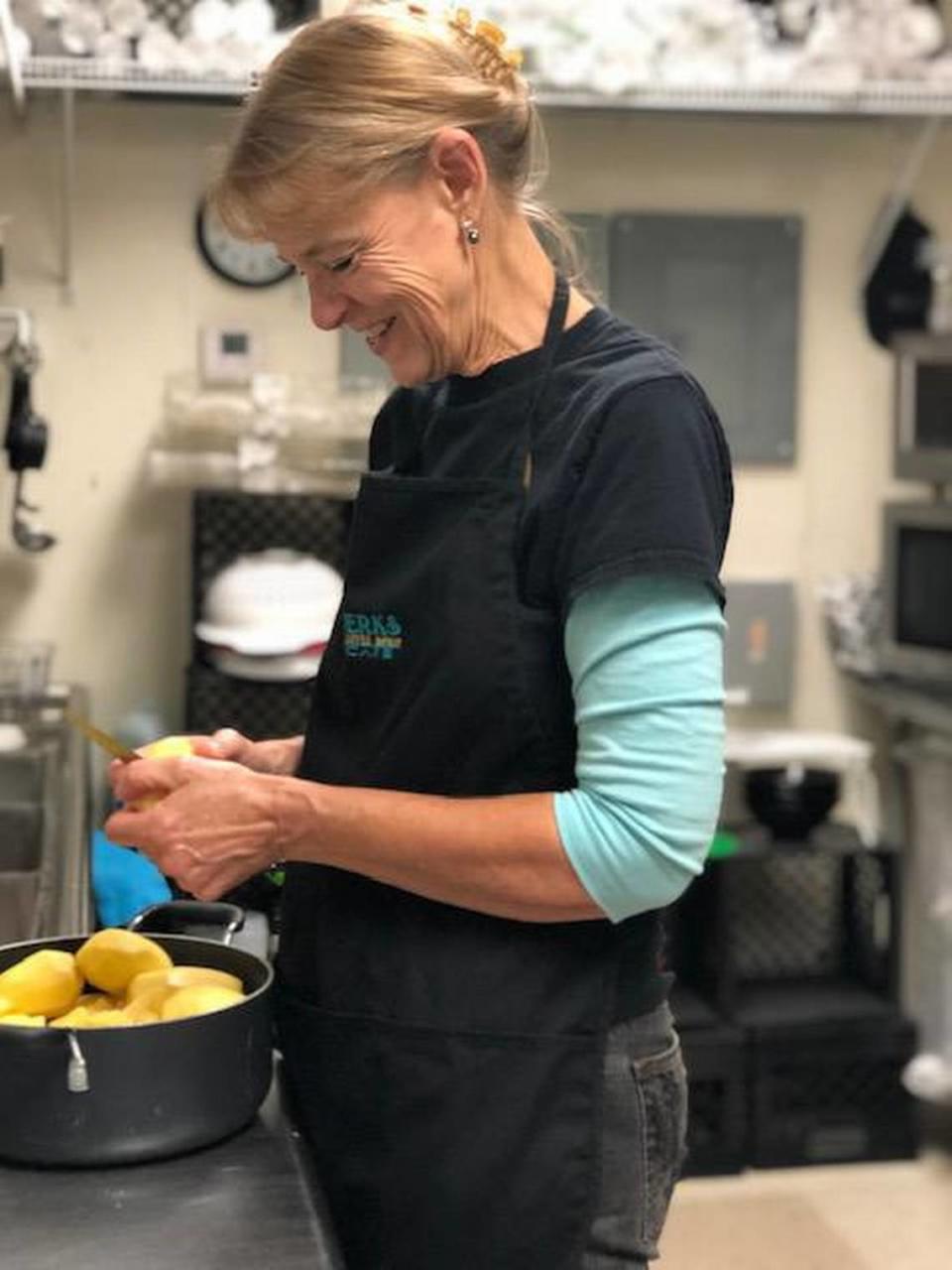 Perks co-owner Linda Lyon prepares potato salad from scratch. The popular side comes with any sandwich or wrap.