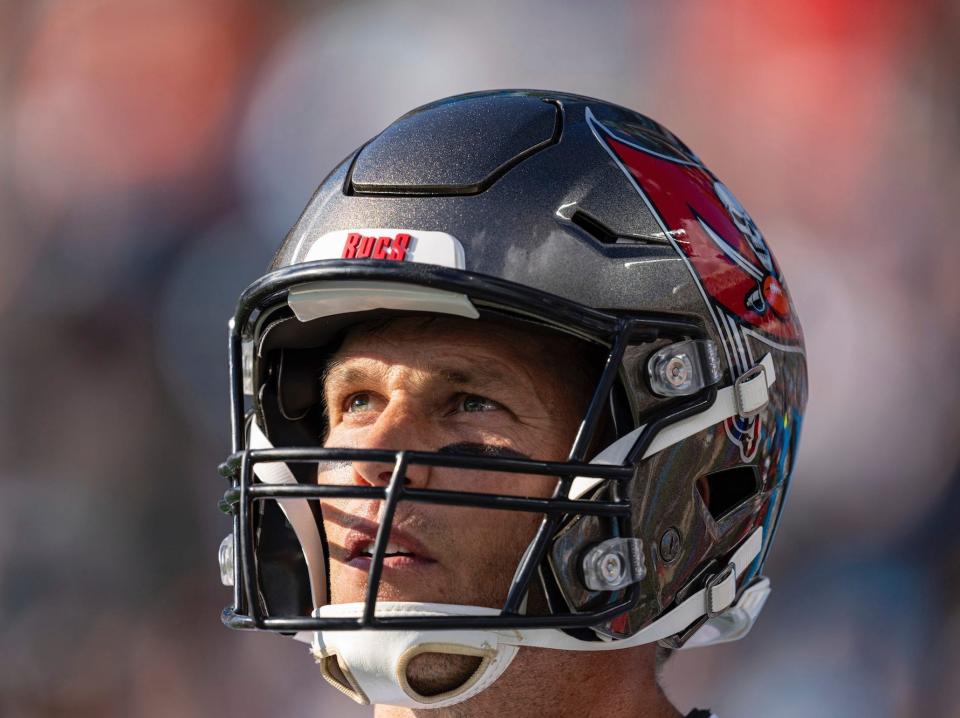 Tom Brady looks up into the sun during a game in 2021.