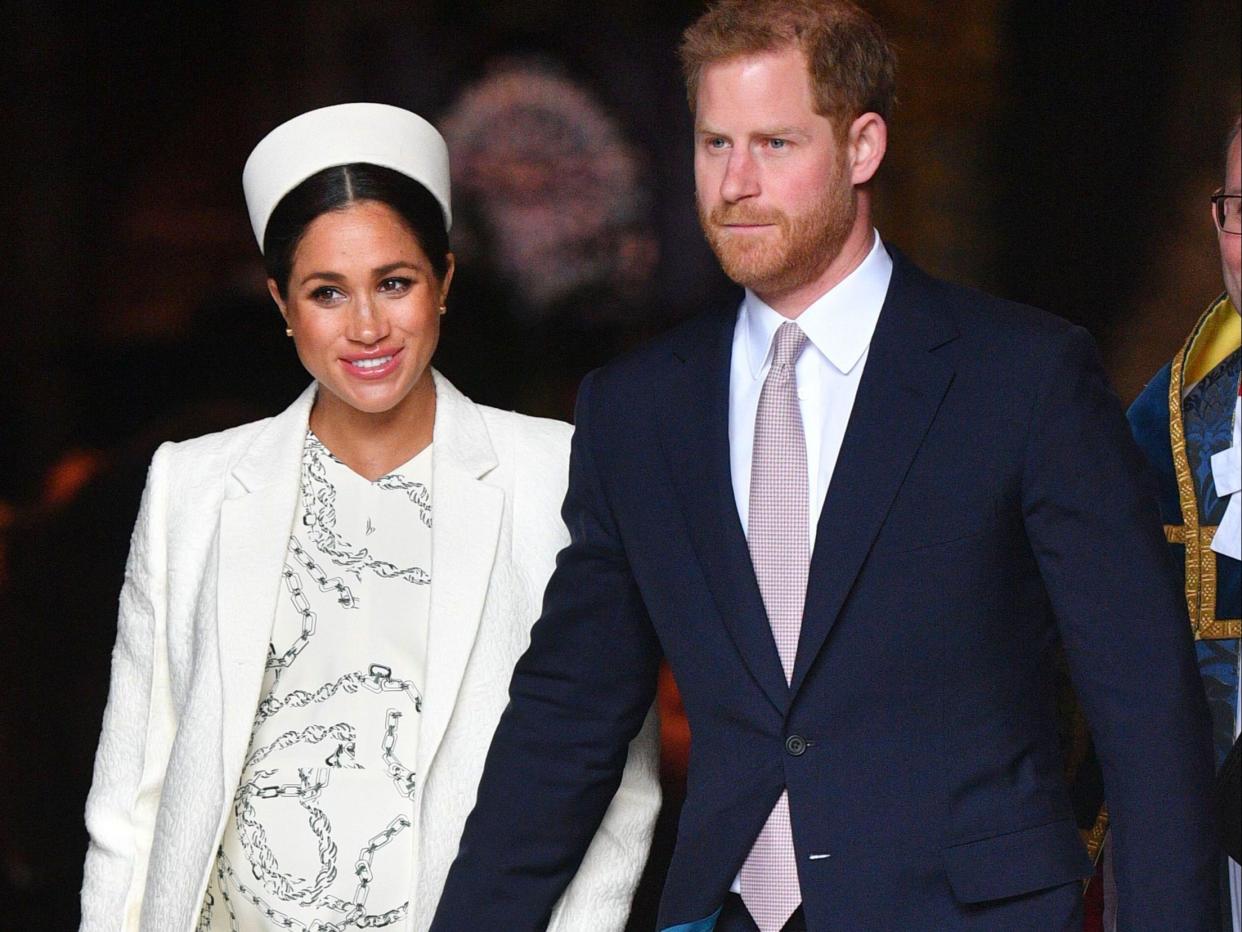 Meghan Markle and Prince Harry walk hand-in-hand (Tim Rooke/REX/Shutterstock)