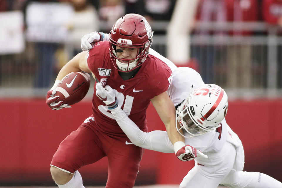 FILE - In this Nov. 16, 2019, file photo, Washington State running back Max Borghi, left, carries the ball during the first half of an NCAA college football game in Pullman, Wash. Borghi is likely to get more rushing attempts under the new Washington coach Nick Rolovich. (AP Photo/Young Kwak, File)