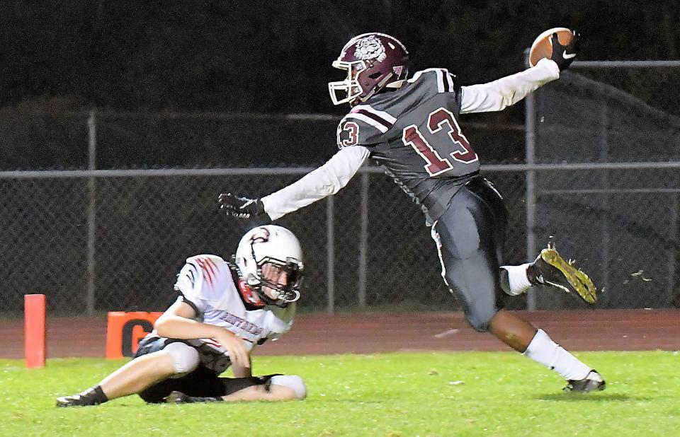 Woodridge wide receiver Kamari Mitchell celebrates after scoring a touchdown in the Bulldogs' 23-20 home overtime win over Norton Sept. 25. Mitchell caught two touchdowns in the win.