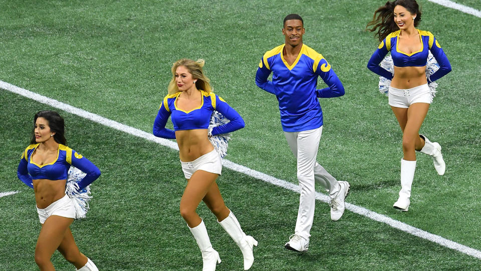 Quinton Peron performs with other cheerleaders. (Photo by ANGELA WEISS/AFP/Getty Images)