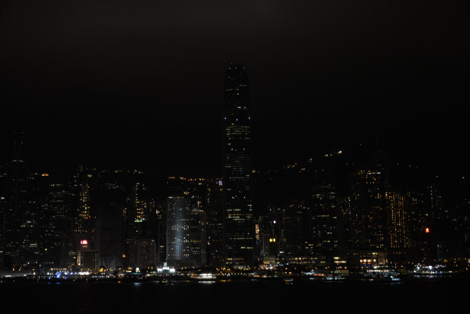 HONG KONG, CHINA - MARCH 24:  Buildings' lights are turned off during the Earth Hour along the Victoria Harbour on March 24, 2018 in Hong Kong, China. People switch off their lights for one hour during the annual Earth Hour events around world.  (Photo by Visual China Group via Getty Images/Visual China Group via Getty Images)