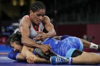 Guinea?s Fatoumata Yarie Camara, above, competes with Moldova?s Anastasia Nichita during the women's 57kg Freestyle wrestling repechage match at the 2020 Summer Olympics, Thursday, Aug. 5, 2021, in Tokyo, Japan. (AP Photo/Aaron Favila)