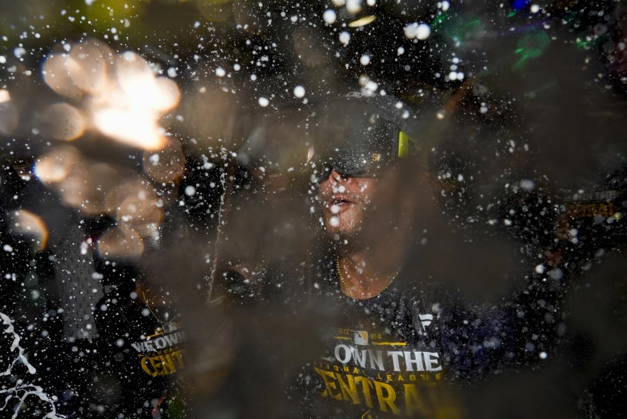 Milwaukee Brewers' Freddy Peralta is douced after a baseball game against the Philadelphia Phillies Wednesday, Sept. 18, 2024, in Milwaukee. The Brewers won 2-1 and clinched the National League Central division. (AP Photo/Morry Gash)