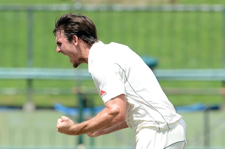 Australia's Mitchell Marsh celebrates the dismissal of Sri Lanka's Dinesh Chandimal on the third day of the opening Test in Pallekele on July 28, 2016