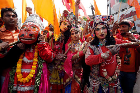 Supporters of India’s Prime Minister Narendra Modi dressed as deities attend a roadshow in Varanasi, India, April 25, 2019. REUTERS/Adnan Abidi