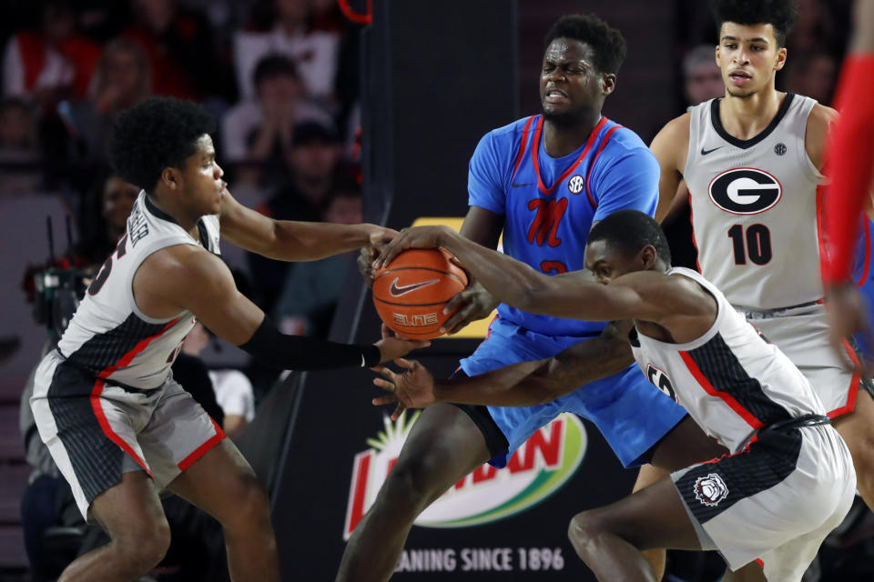 Mississippi forward Khadim Sy (3) competes for the ball with Georgia's Sahvir Wheeler (15) and Jordan Harris (2) during an NCAA college basketball game in Athens, Ga., Saturday, Jan. 25, 2020. (Joshua L. Jones/Athens Banner-Herald via AP)