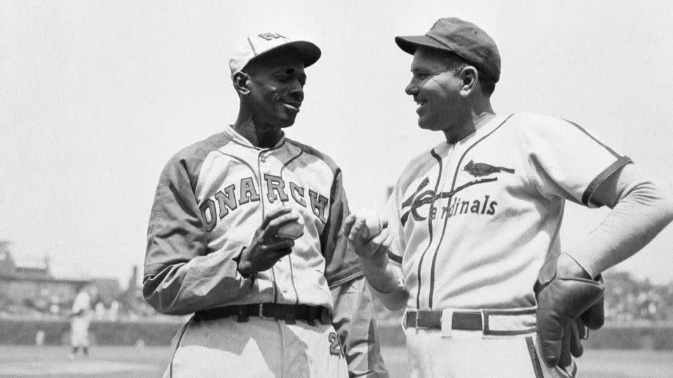 Satchel Paige (L) and Dizzy Dean at an exhibition game at Wrigley Field in Chicago, comparing grips in 1947. - Mark Rucker/Transcendental Graphics/Getty Images