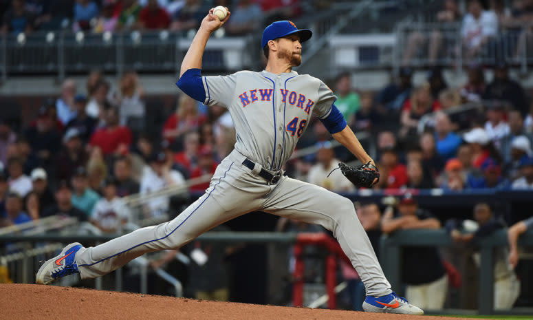 Jacob deGrom throwing a pitch.