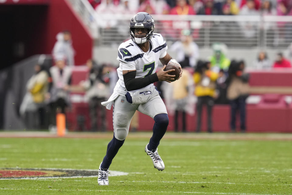 Seattle Seahawks quarterback Geno Smith (7) scrambles against the San Francisco 49ers during the first half of an NFL wild card playoff football game in Santa Clara, Calif., Saturday, Jan. 14, 2023. (AP Photo/Godofredo A. Vásquez)