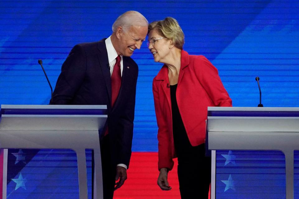 Former Vice President Joe Biden and Sen. Elizabeth Warren, D-Mass., talk Sept. 12 during a Democratic presidential primary debate hosted by ABC at Texas Southern University in Houston.