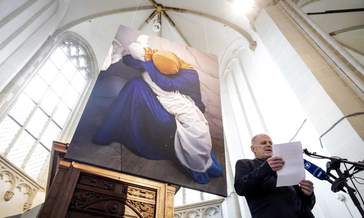 <span>The announcement of the winning photograph, taken by Mohammed Salem for Reuters, which shows a woman in Gaza cradling the dead body of her five-year-old niece.</span><span>Photograph: Robin van Lonkhuijsen/EPA</span>