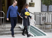 FILE- In this Thursday, Dec. 6, 2012 file photo, Britain's Prince William stand next to his wife Kate, Duchess of Cambridge as she leaves the King Edward VII hospital in central London. Prince William and his wife Kate are expecting their first child, and the Duchess of Cambridge was admitted to hospital suffering from a severe form of morning sickness in the early stages of her pregnancy. King Edward VII hospital says a nurse involved in a prank telephone call to elicit information about the Duchess of Cambridge has died. The hospital said Friday, Dec. 7, 2012 that Jacintha Saldanha had been a victim of the call made by two Australian radio disc jockeys. They did not immediately say what role she played in the call. (AP Photo/Alastair Grant, File)