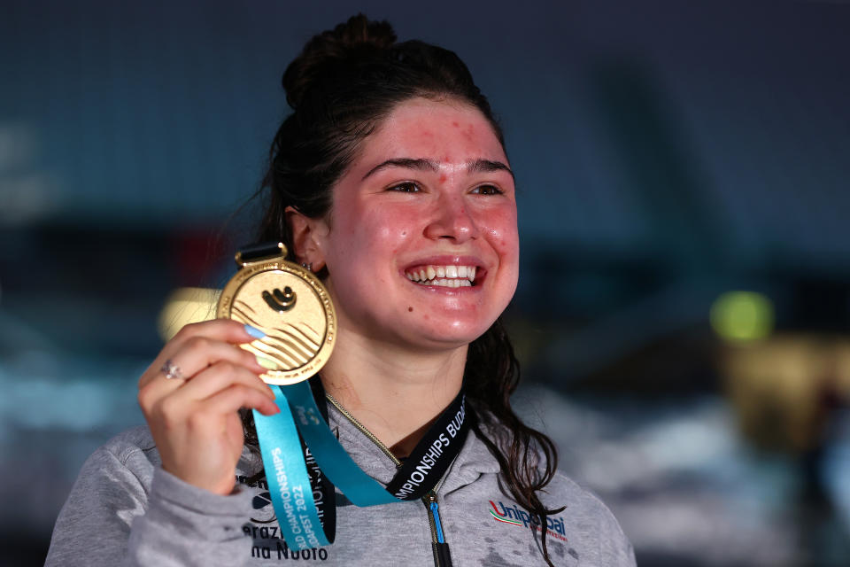 Benedetta Pilato, pictured here with her gold medal at the swimming world championships.