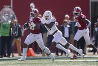 Indiana's Chris Childers (36) is tackled by Michigan State's Ronald Williams (9) during the first half of an NCAA college football game, Saturday, Oct. 16, 2021, in Bloomington, Ind. (AP Photo/Darron Cummings)