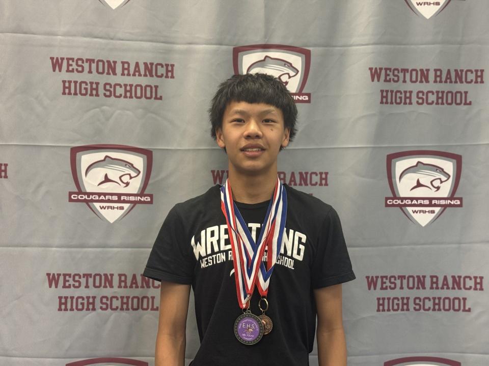 Weston Ranch's Maddox Lo poses for a picture wearing some of his wrestling medals after being named the RecordNet Fan Fav Boys Wrestler of the Year.