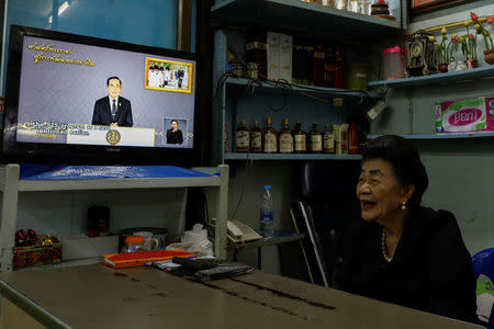 A woman watch Thailand Prime Minister Prayuth Chan-ocha during his weekly TV broadcast in Bangkok, Thailand, May 19, 2017. Picture taken May 19, 2017. REUTERS/Jorge Silva