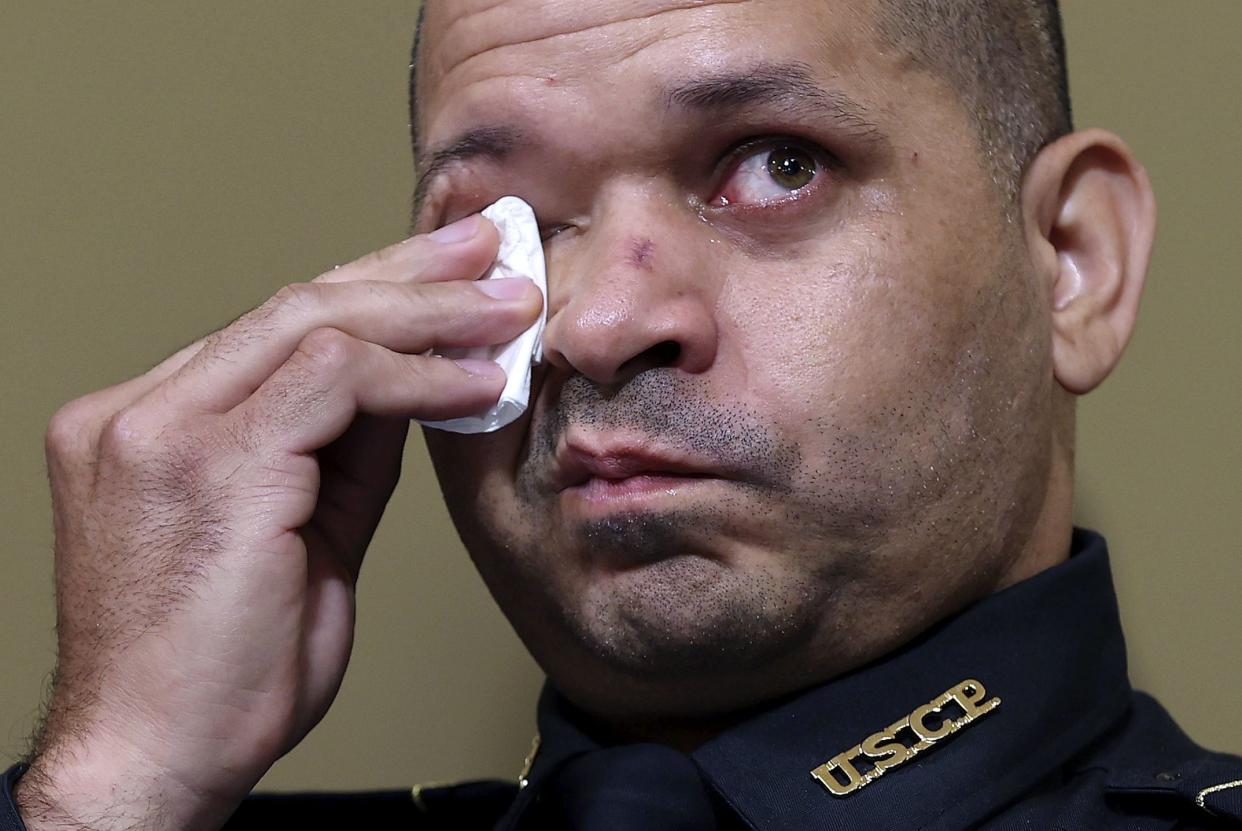 U.S. Capitol Police Sgt. Aquilino Gonell becomes emotional as he testifies before the House select committee hearing on the Jan. 6 attack on Capitol Hill in Washington, Tuesday, July 27, 2021.