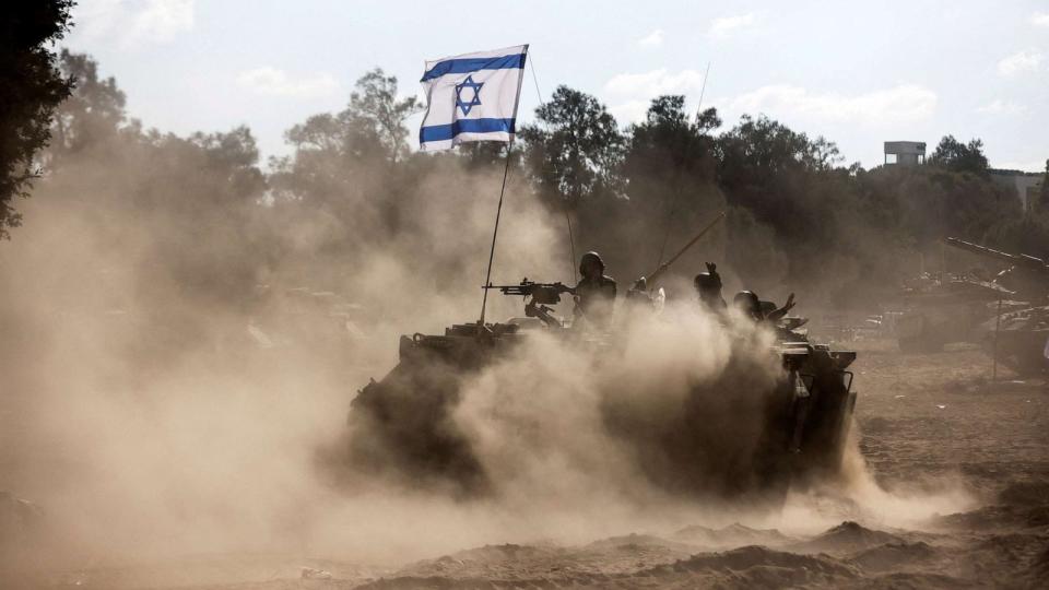 PHOTO: An Israeli Armored Personnel Carrier (APC) takes position near Israel's border with the Gaza Strip, in southern Israel, Oct. 13, 2023. (Amir Cohen/Reuters)