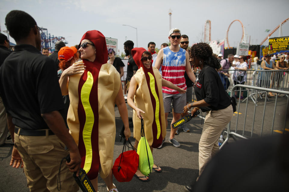 Women dressed as hot dogs are checked as they&nbsp;arrive at the annual Nathan's Hot Dog Eating Contest.