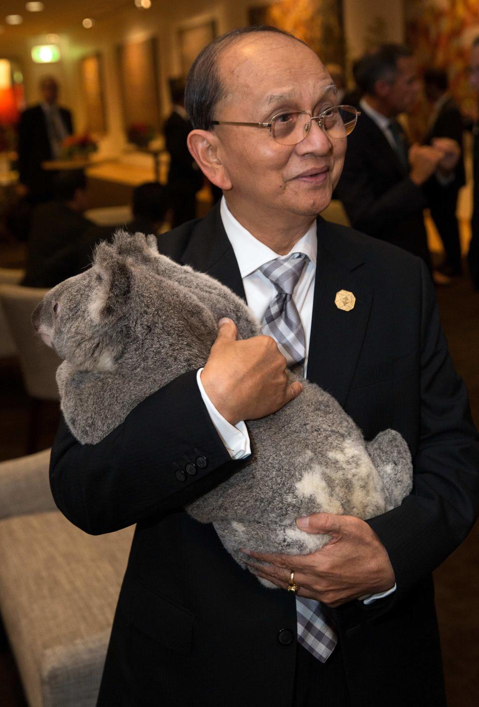 G20 handout photo shows Myanmar's President Thein Sein holding a koala before the G20 Leaders' Summit in Brisbane