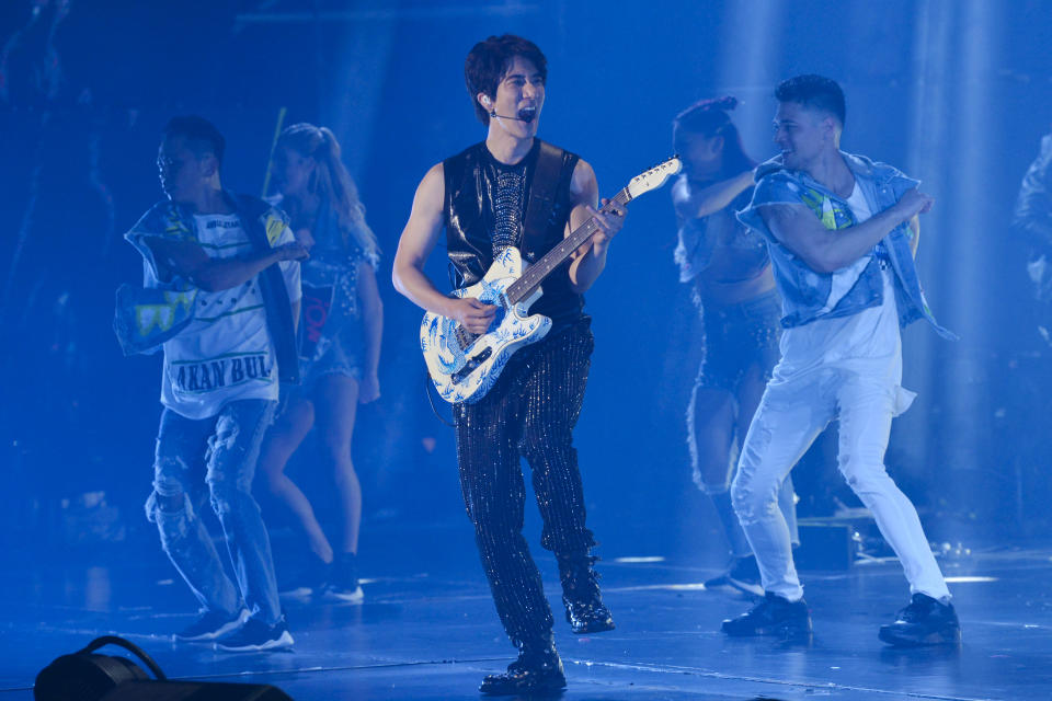 Wang Leehom, an American songwriter and singer performs on stage during his solo concert in Nanjing in east China's Jiangsu province on May 20, 2018. Wang, who is one of the biggest pop stars in China apologized to his family and fans on Monday, Dec. 20, 2021, and said he would take a break from performing after a public dispute on social media with his ex-wife, who accused him of infidelity and hiring prostitutes. (Chinatopix via AP)