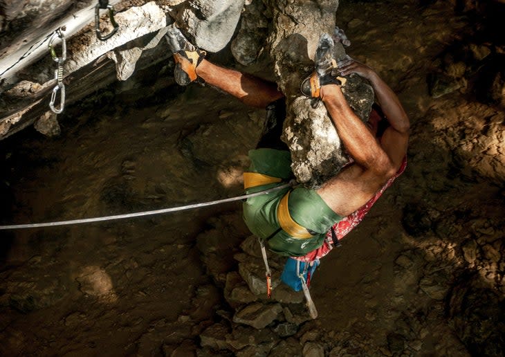 Rock climber on limestone feature in Cuba.