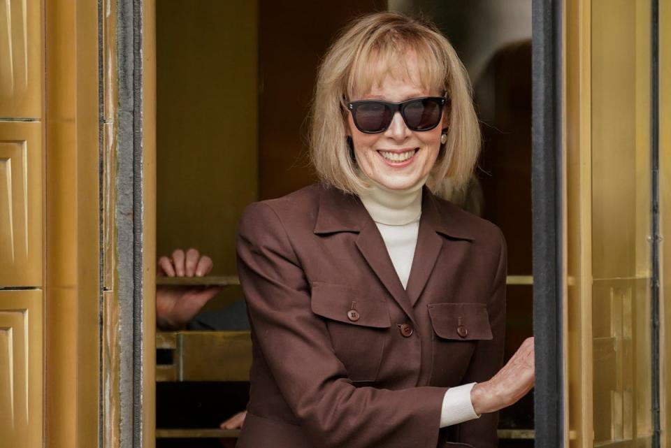 E Jean Carroll, center, walks out of Manhattan federal court, Tuesday, May 9, 2023, in New York (Copyright 2023 The Associated Press. All rights reserved.)