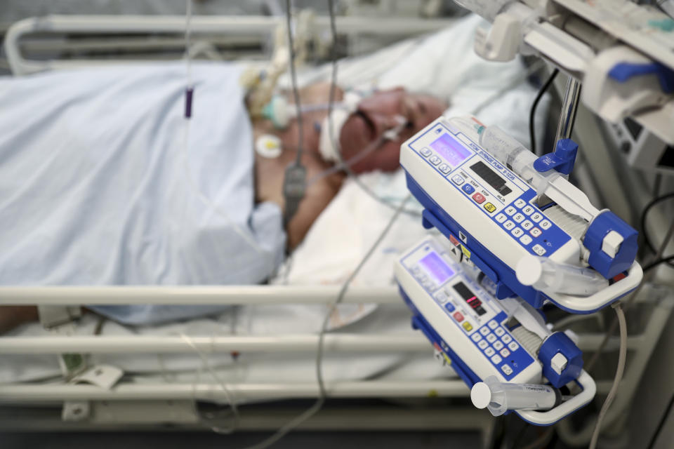 A patient lies on a bed at the COVID-19 ICU unit of the Dr. Abdulah Nakas General Hospital in Sarajevo, Bosnia, Friday, Sept. 24, 2021. Public mistrust of authorities in corruption-plagued Bosnia has created an opening for anti-vaccination movement even though the Balkan nation has the highest rate in Europe of coronavirus deaths and faces a growing number of new infections. So far, despite an abundance of coronavirus vaccines in Bosnia, just under 13 percent of its 3.3 million people had been fully immunized against Covid-19. (AP Photo)