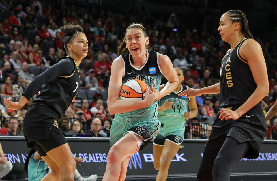 Breanna Stewart drives between Alysha Clark and Kiah Stokes. (Photo by Ethan Miller/Getty Images)