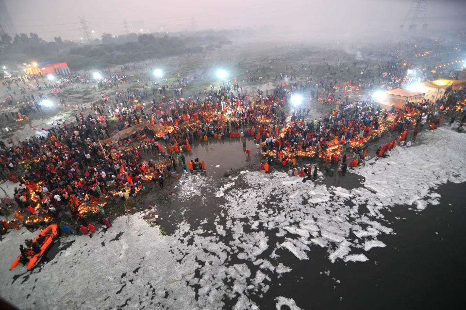 <p>Devotees women offer prayers of Holy Water to Surya Bhagwan (The Sun God Rises), during the celebration of Chhat Puja Festival on the Yamuna River, despite the high pollution of the river with toxic foam due to the high activity of factories near the place , the local authorities have not taken measures to avoid environmental pollution. New Delhi, India, November 11, 2021. Photo by Ravi Batra/Eyepix/ABACAPRESS.COM</p> 