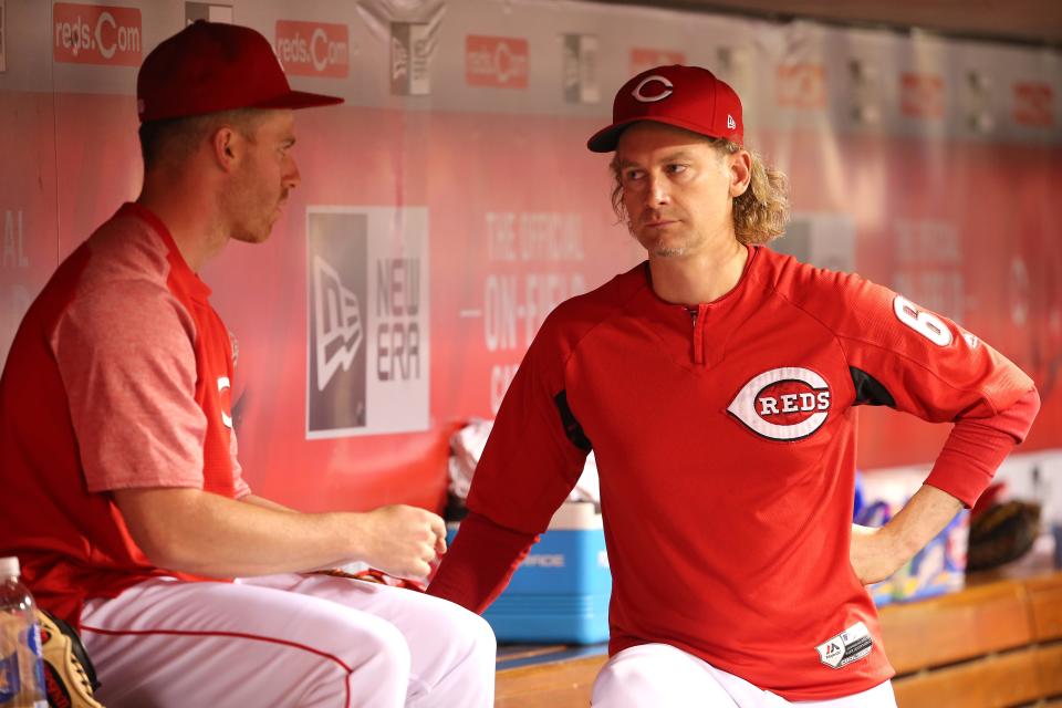 Cincinnati Reds pitcher Bronson Arroyo (61), right, talks with pitcher Anthony DeSclafani (28) during the game against the New York Mets, Tuesday, Aug. 29, 2017, at Great American Ball Park.