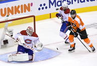 Montreal Canadiens goaltender Carey Price (31) makes a save as Philadelphia Flyers' Sean Couturier (14) and Canadiens' Ben Chiarot (8) battle during the third period of an NHL Eastern Conference Stanley Cup hockey playoff game in Toronto, Wednesday, Aug. 12, 2020. (Frank Gunn/The Canadian Press via AP)